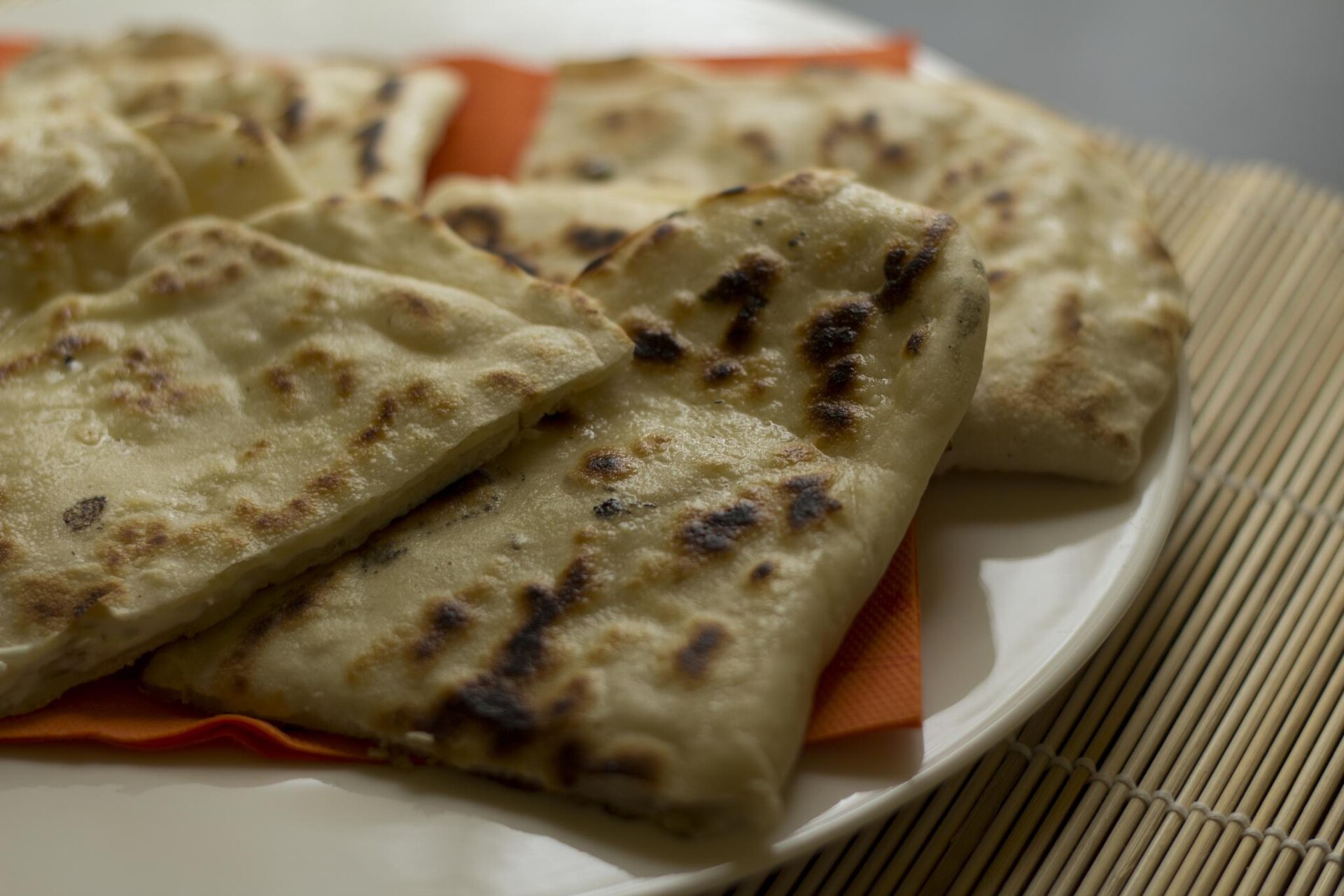 Cheese naan on a plate.