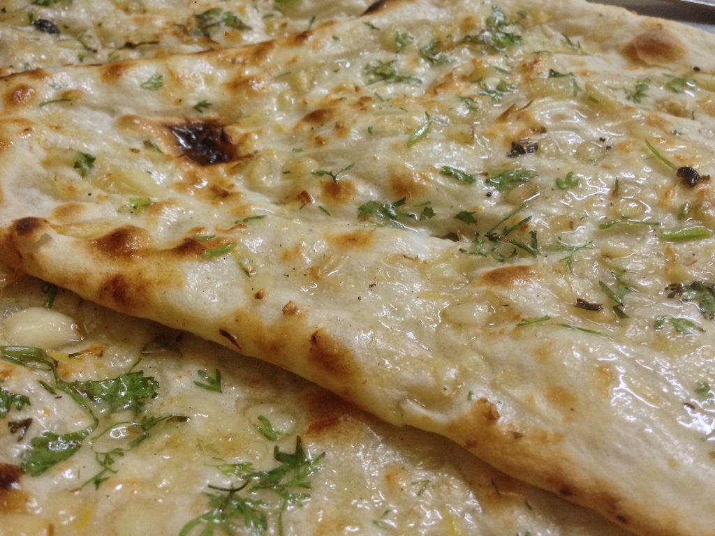 Butter garlic naan with herbs.